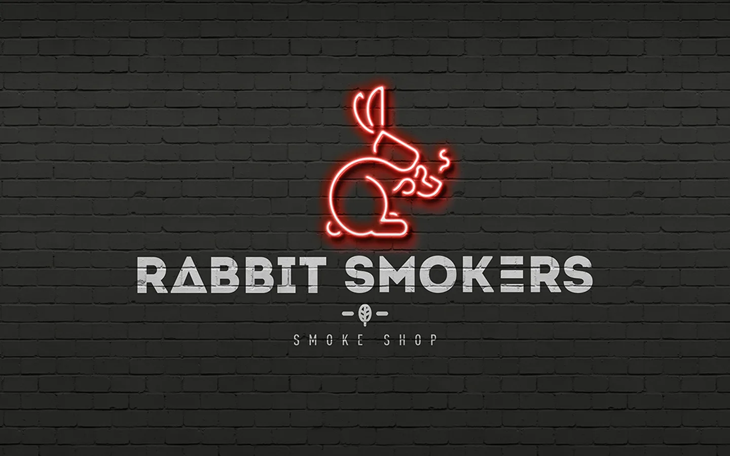 Rabbit Smokers red neon rabbit symbol and white wordmark on a black brick wall.